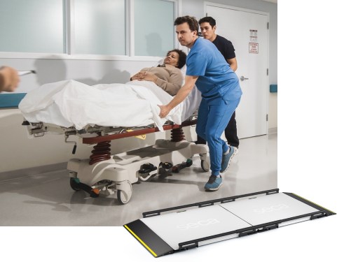 A hospital scene showing two healthcare professionals, one in blue scrubs and the other in dark clothing, pushing a patient lying on a stretcher through a hallway. The patient is covered with a white blanket and appears calm. In the lower section of the image, there is a large, flat platform-style medical scale designed for stretchers (seca XLine Stretch), with yellow safety edges and the brand name 'seca' printed on the surface.